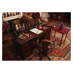 An aerial view photograph print of Sigmund Freud's desk and chair.