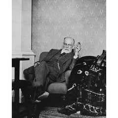 Photo of Sigmund Freud sat behind his couch