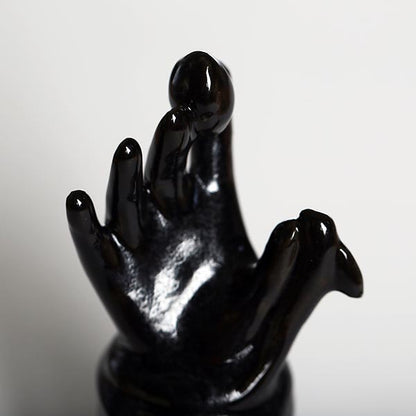 Hand Holding an Egg, with a Snake Wrapped Around Wrist - Martha Todd