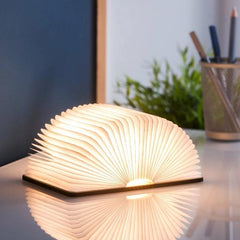 sculptural light emitting a wonderful ambient warm white soft LED light through the pages