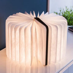 sculptural light emitting a wonderful ambient warm white soft LED light through the pages