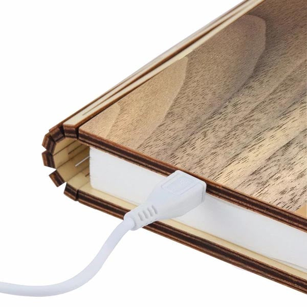 sculptural light emitting a wonderful ambient warm white soft LED light through the pages
